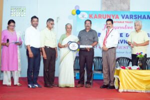 Key of the new Ambulance handing over by Sri Rojan Mathew to Smt Thresiamma John,Trustee