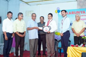 key of the Hearse donated by The South Indian Bank handing over the operation Head to the Sri Augustine, Trustee